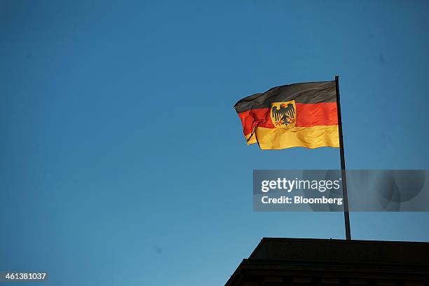 The German national flag flies over the German finance ministry in Berlin, Germany, on Wednesday, Jan. 8, 2014. Jacob "Jack" Lew, U.S. Treasury...