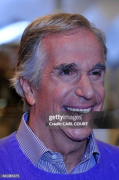 Actor Henry Winkler poses during a photocall at Ed's Easy Diner in central London on January 8, 2014 to launch the new musical Happy Days. Henry...