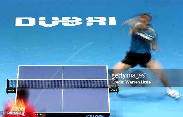 Robert Gardos of Austria in action against Zhang Jike of China during the Men's Final of the 2015 ITTF World Team Cup at Al Nasr Sports Stadium on...