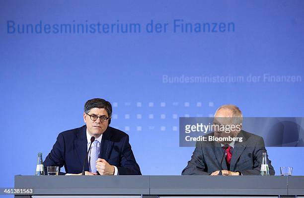 Jacob "Jack" Lew, U.S. Treasury secretary, left, speaks beside Wolfgang Schaeuble, Germany's finance minister, during a news conference at the German...