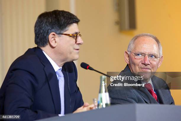 Wolfgang Schaeuble, Germany's finance minister, right, reacts as Jacob "Jack" Lew, U.S. Treasury secretary, speaks during a news conference at the...