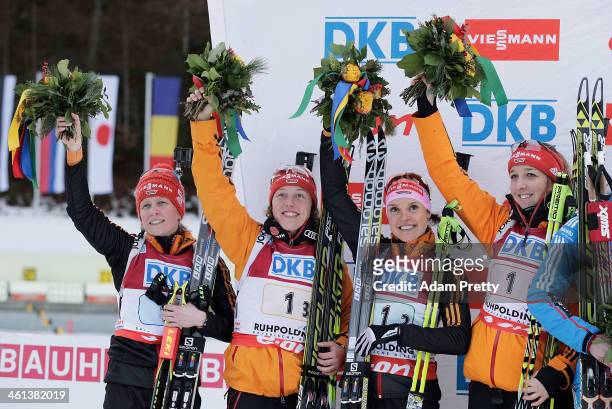 Andrea Henkel, Laura Dahlmeier, Evi Sachenbacher-Stehle and Franziska Preuss of Germany celebrate second place after the women's 4x6km relay on day...