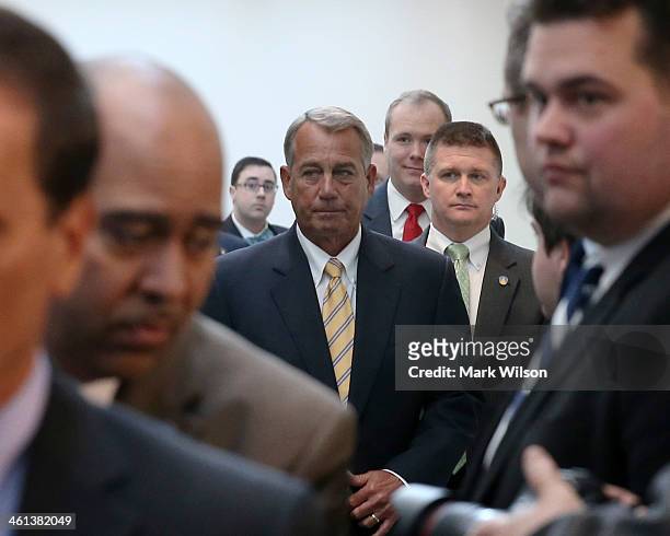 House Speaker John Boehner walks up to speak to the media after attending the weekly House Republican conference at the U.S. Capitol, January 8, 2014...