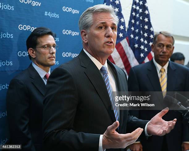 House Majority Whip Kevin McCarthy speaks to the media while flanked by House Majority Leader Eric Cantor and House Speaker John Boehner , after...