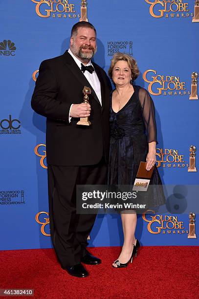 Writer/director Dean DeBlois and producer Bonnie Arnold, winners of Best Animated Feature Film for 'How to Train Your Dragon 2,' pose in the press...