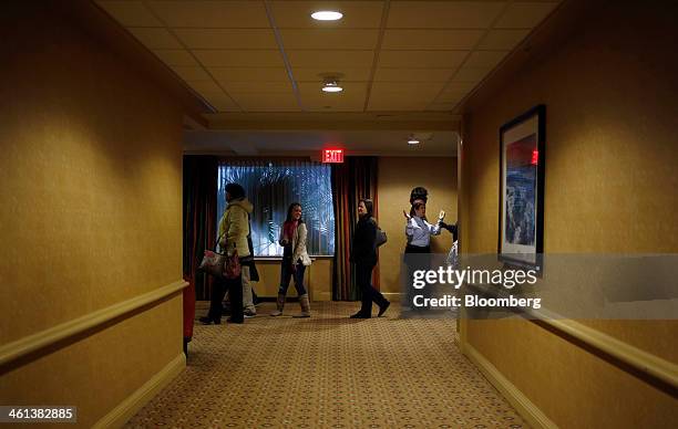 People wait in line to enter a job fair held by Kentucky Kingdom amusement park to hire seasonal summer workers in Louisville, Kentucky, U.S. On...