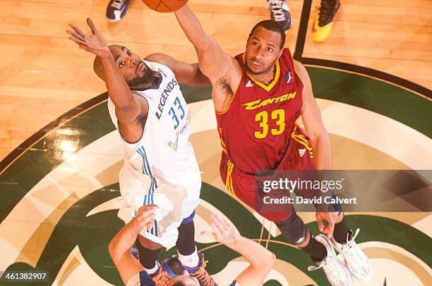 Shane Edwards of the Canton Charge wins the opening tip over Melvin Ely of the Texas Legends during the 2014 NBA D-League Showcase on January 7, 2014...