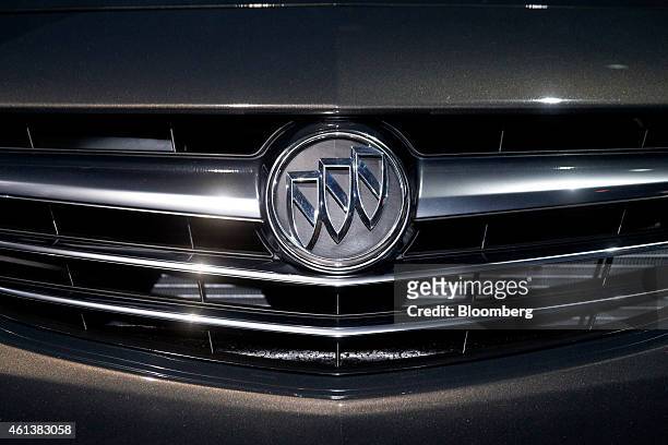 General Motors Co. Buick badge is seen on the grille of a 2016 Cascada convertible vehicle on display during the car's unveiling at an event ahead of...