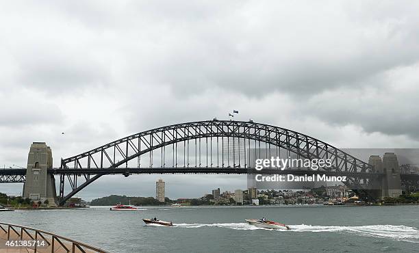 Roger Federer of Switzerland and Lleyton Hewitt of Australia arrive by boat to the launch of Fast 4 Tennis on January 12, 2015 in Sydney, Australia.