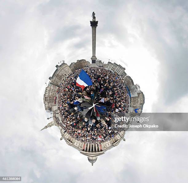 People gather in Trafalgar Square to show their respect to victims of the terrorist attacks in Paris on January 11, 2015 in London, England. London...