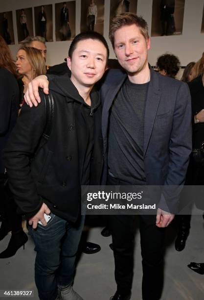 Haizhen Wang and Burberry Chief Creative Officer Christopher Bailey poses backstage during the Burberry AW14 Menswear Show at Kensington Gardens on...