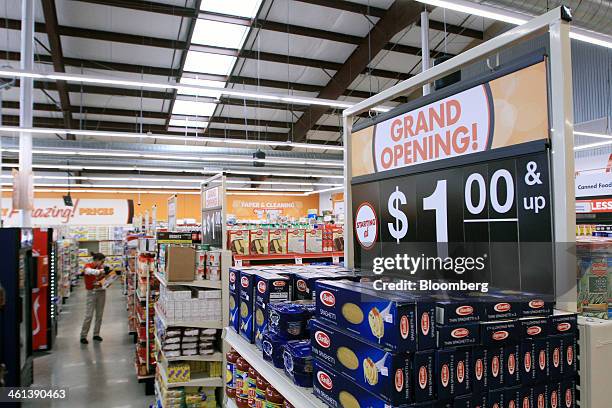 An employee scans merchandise inside a Family Dollar Stores Inc. Location in Mansfield, Texas, U.S., on Tuesday, Jan. 7, 2014. Family Dollar Stores...