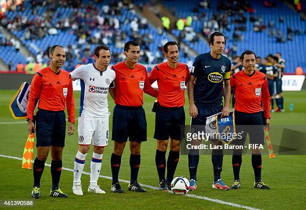 Gerardo Torrado of Cruz Azul and Ivan Vicelich of Auckland City FC pose with the referees during the FIFA Club World Cup 3rd Place match between Cruz...