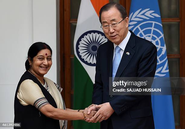 Secretary General Ban Ki-moon shakes hands with Indian External Affairs Minister Sushma Swaraj ahead of their meeting in New Delhi on January 12,...
