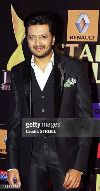 Indian Bollywood actor Ritesh Deshmukh poses for a photograph during the 'Star Guild Awards 2015' in Mumbai on late January 11, 2015. AFP PHOTO / STR