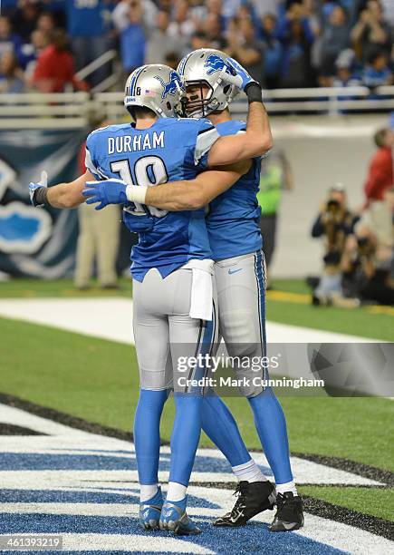 Kris Durham and Joseph Fauria of the Detroit Lions celebrate a touchdown during the game against the New York Giants at Ford Field on December 22,...
