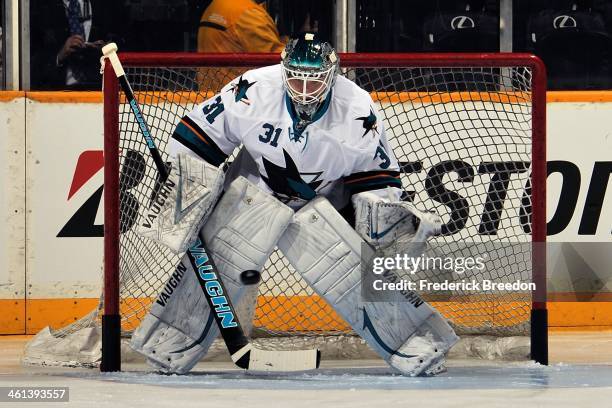 Goalie Antti Niemi of the San Jose Sharks warms up prior to a game against the Nashville Predators at Bridgestone Arena on January 7, 2014 in...