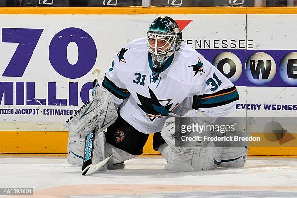Goalie Antti Niemi of the San Jose Sharks warms up prior to a game against the Nashville Predators at Bridgestone Arena on January 7, 2014 in...