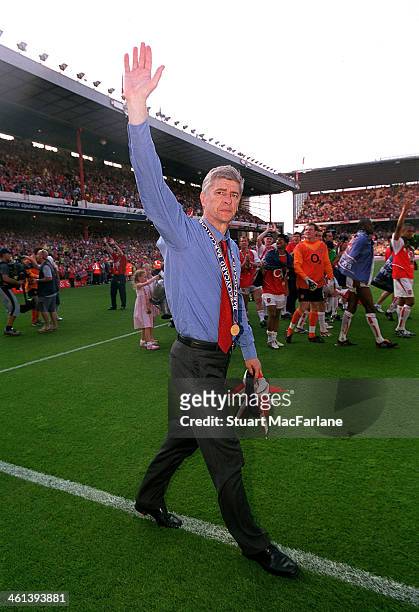 Arsenal manager Arsene Wenger celebrates after winning the Premier League, Arsenal Stadium, Highbury, on May 15, 2004 in London, England.
