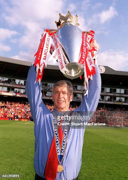 Arsenal manager Arsene Wenger celebrates after winning the Premier League, Arsenal Stadium, Highbury on May 15, 2004 in London, England.