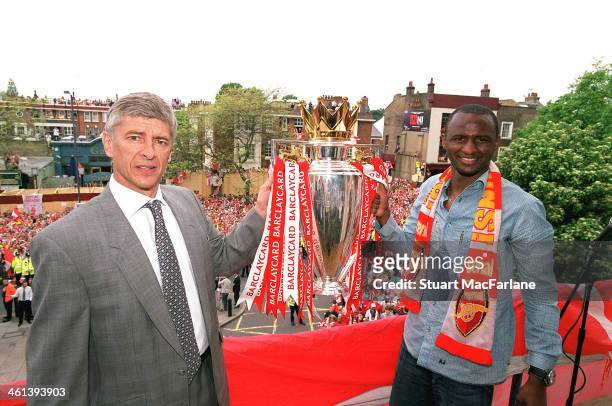 Arsenal manager Arsene Wenger and captain Patrick Vieira hold the Premier League trophy at Islington Town Hall on May 19, 2004 in London, England.