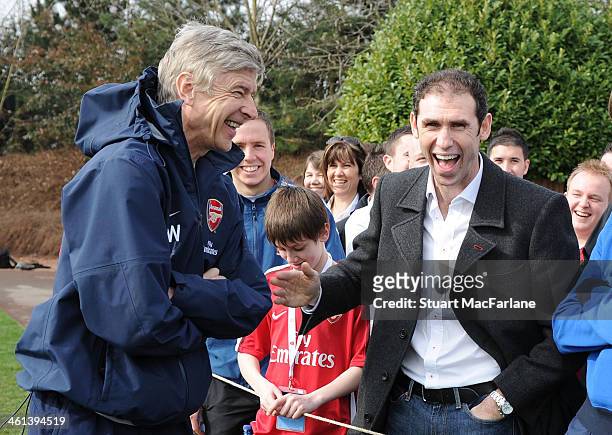 Arsenal manager Arsene Wenger with ex player Martin Keown at the Arsenal Training Ground on March 18, 2010 in London, England.