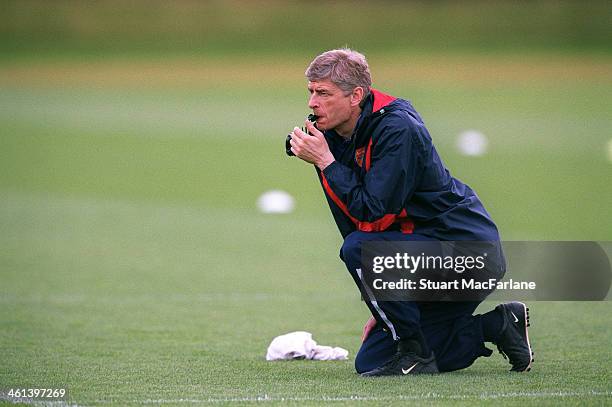 Arsenal manager Arsene Wenger during a training session at London Colney on April 15, 2003 in St Albans, England.