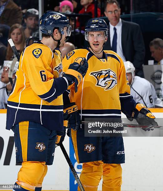 Roman Josi talks with Shea Weber of the Nashville Predators during a break in play against the Los Angeles Kings at Bridgestone Arena on December 28,...