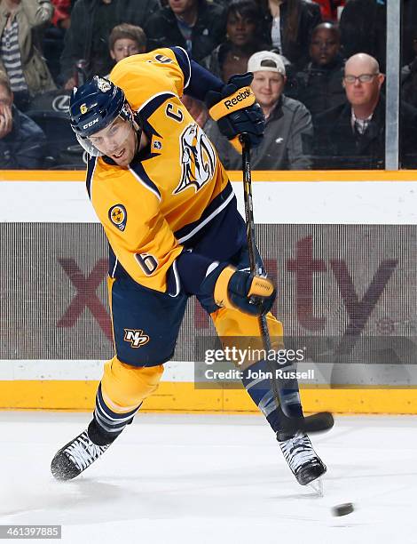 Shea Weber of the Nashville Predators takes a slapshot against the Los Angeles Kings at Bridgestone Arena on December 28, 2013 in Nashville,...