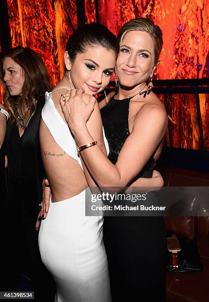 Singer Selena Gomez and actress Jennifer Aniston attend the 2015 InStyle And Warner Bros. 72nd Annual Golden Globe Awards Post-Party at The Beverly...