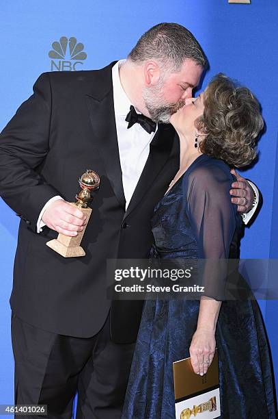 Writer/director Dean DeBlois and producer Bonnie Arnold, winners of Best Animated Feature Film for 'How to Train Your Dragon 2,' pose in the press...