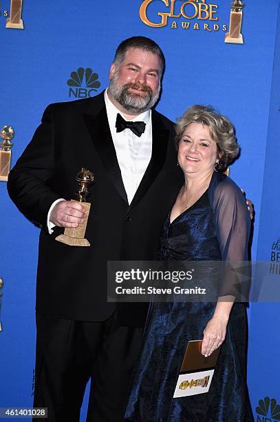 Writer/director Dean DeBlois and producer Bonnie Arnold, winners of Best Animated Feature Film for 'How to Train Your Dragon 2,' pose in the press...