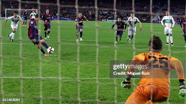 Lionel Messi of FC Barcelona scores the third goal during the Copa del Rey match between FC Barcelona and Elche CF at Camp Nou on January 8, 2015 in...