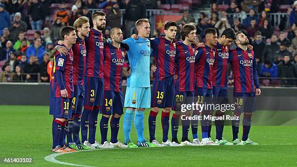 Barcelona's players observe a minute of silence in homage to the victims of Charlie Hebdo during the Copa del Rey match between FC Barcelona and...