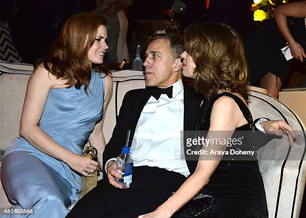 Actress Amy Adams, actor Christophe Waltz, and Judith Holste attend The Weinstein Company & Netflix's 2015 Golden Globes After Party presented by...