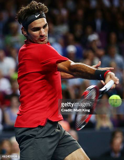 Roger Federer of Switzerland plays a forehand against Lleyton Hewitt of Australia during their match at Qantas Credit Union Arena on January 12, 2015...