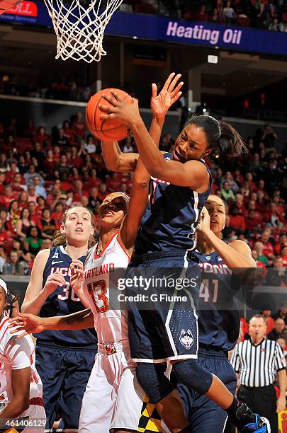 Brianna Banks of the Connecticut Huskies grabs a rebound against Alicia DeVaughn of the Maryland Terrapins at the Comcast Center on November 15, 2013...