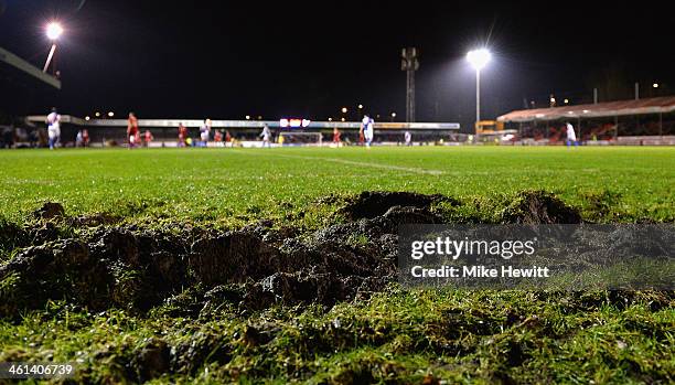 The game goes ahead despite the pitch being a quagmire behind the goal line during] the FA Cup Second Round Replay between Crawley Town and Bristol...