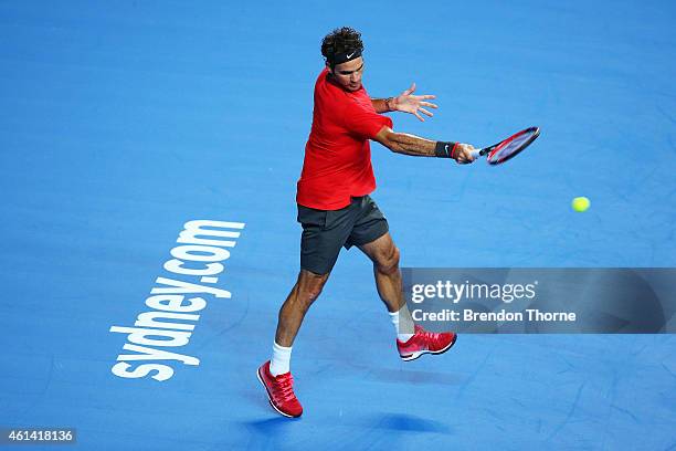 Roger Federer of Switzerland plays a forehand against Lleyton Hewitt of Australia during their match at Qantas Credit Union Arena on January 12, 2015...