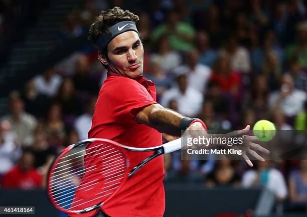 Roger Federer of Switzerland plays a forehand against Lleyton Hewitt of Australia during their match at Qantas Credit Union Arena on January 12, 2015...