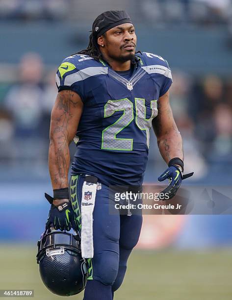 Running back Marshawn Lynch of the Seattle Seahawks looks on during the game against the St. Louis Rams at CenturyLink Field on December 29, 2013 in...