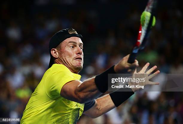 Lleyton Hewitt of Australia plays a forehand against Roger Federer of Switzerland during their match at Qantas Credit Union Arena on January 12, 2015...