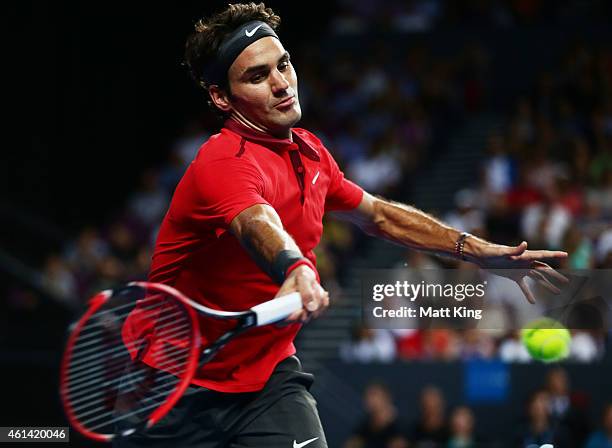 Roger Federer of Switzerland plays a forehand against Lleyton Hewitt of Australia during their match at Qantas Credit Union Arena on January 12, 2015...