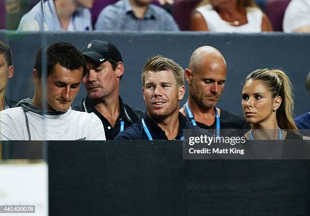 Australian tennis players Bernard Tomic, Australian cricketer David Warner and his partner Candice Falzon during their match at Qantas Credit Union...