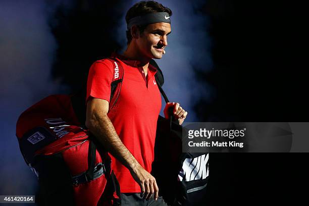 Roger Federer of Switzerland walks onto court for his match against Lleyton Hewitt of Australia at Qantas Credit Union Arena on January 12, 2015 in...