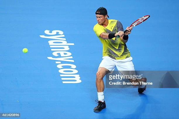 Lleyton Hewitt of Australia plays a backhand against Roger Federer of Switzerland during their match at Qantas Credit Union Arena on January 12, 2015...