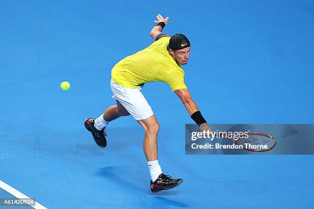 Lleyton Hewitt of Australia plays a backhand against Roger Federer of Switzerland during their match at Qantas Credit Union Arena on January 12, 2015...