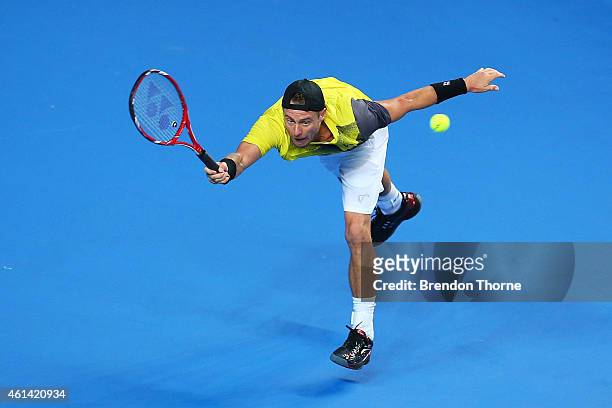 Lleyton Hewitt of Australia plays a forehand against Roger Federer of Switzerland during their match at Qantas Credit Union Arena on January 12, 2015...