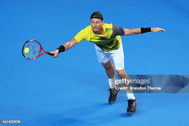 Lleyton Hewitt of Australia plays a forehand against Roger Federer of Switzerland during their match at Qantas Credit Union Arena on January 12, 2015...