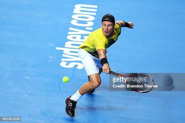 Lleyton Hewitt of Australia plays a backhand against Roger Federer of Switzerland during their match at Qantas Credit Union Arena on January 12, 2015...
